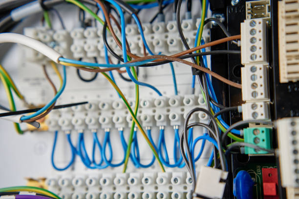 istock Electrical wires connecting to electrical circuit board in distribution box 2199007361