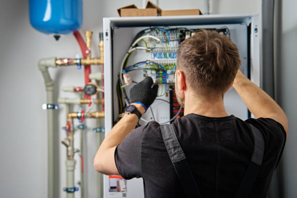istock Electrician Repairing Heat Pump Control Panel 2199007369
