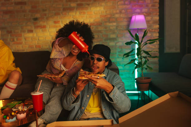 istock Friends enjoy takeout at party. 2199008520