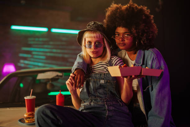 istock Diverse girls with fast food looking at camera. 2199008541