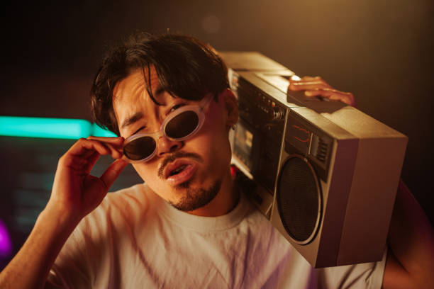 istock Stylish Asian man with boombox. 2199008556