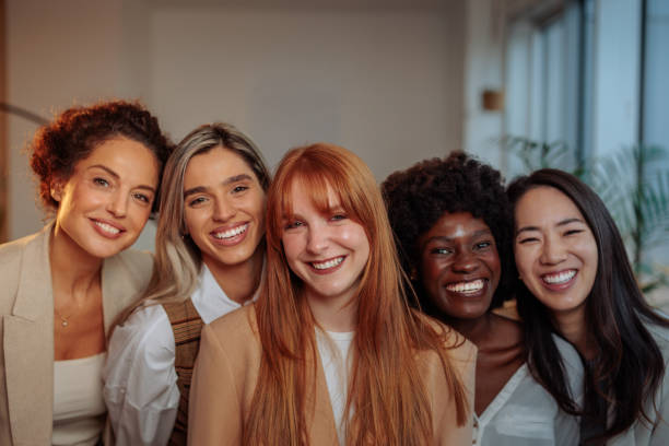 istock Five happy businesswomen in their office 2199008582