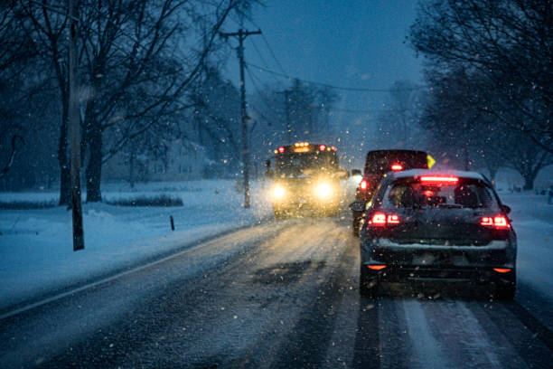 istock Early Morning Blizzard Snow Storm Stopped School Bus 2199010458