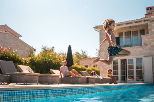 istock Boy's Diving Fun in the Pool 2199010510