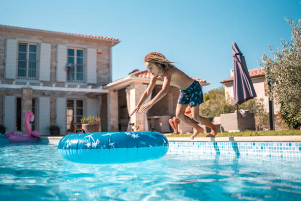 istock Boy's Diving Fun in the Pool 2199010520