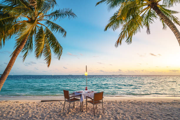 istock Coconut palm trees and beautiful turquoise sea on tropical paradise beach 2199010573