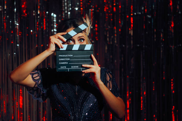 istock Roaring 20s Actress Holding a Film Slate Feeling Excited 2199012820