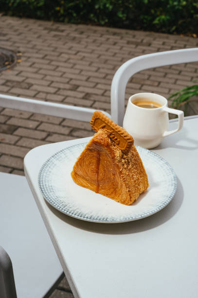 istock dessert on a plate with a cup of coffee 2199014975