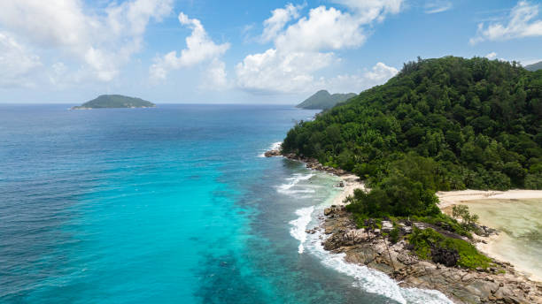 istock Tropical beach with golden sand and blue sea. Seychelles. 2199016603