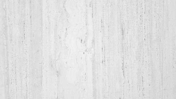 bright textured travertine stone wall with a white background, ideal for creating a classic and elegant ambiance in interior design projects, background for timeless, sophisticated aesthetic concept.