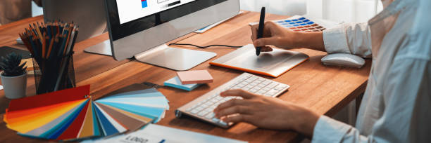 istock Graphic designer works on computer laptop with digital pen. Scrutinize 2199021591