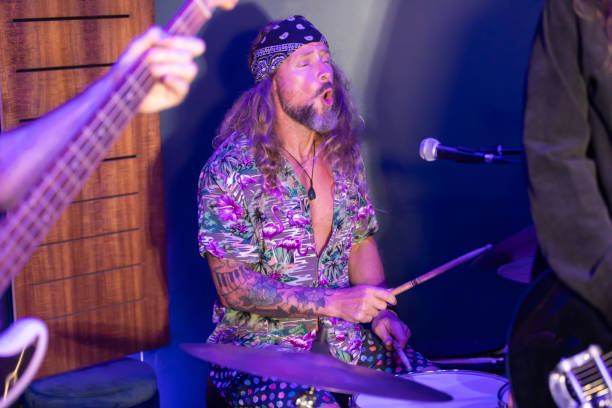 istock Energetic Middle Aged Drummer Playing Music 2199021680