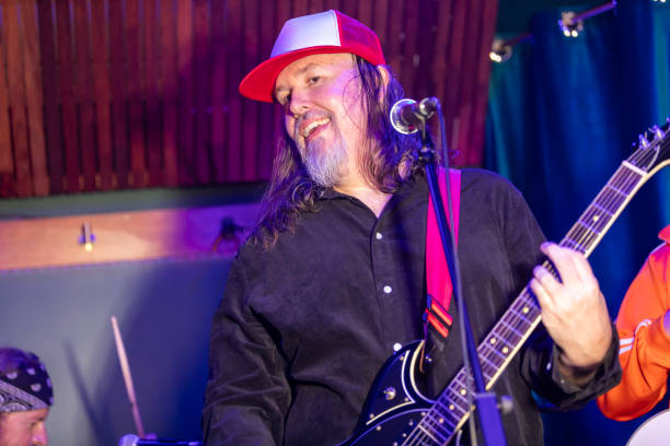 istock Middle aged rock musician having fun playing 2199021681