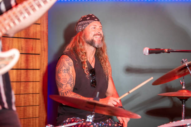istock Energetic Middle Aged Drummer Playing Music 2199021687