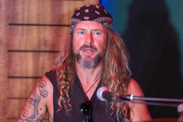 istock Energetic Middle Aged Drummer Playing Music 2199021693