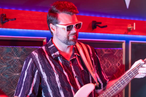 istock Middle aged rock musician having fun playing 2199021700