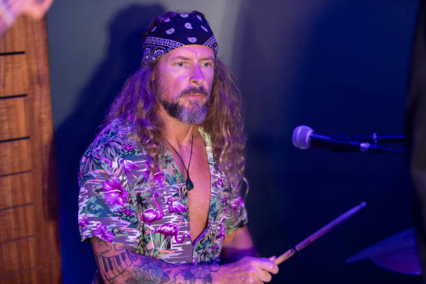 istock Energetic Middle Aged Drummer Playing Music 2199021704