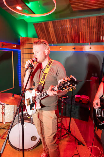 istock Middle aged rock musician having fun playing 2199021716