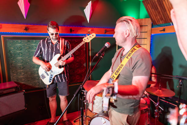istock Middle aged rock musician having fun playing 2199021717