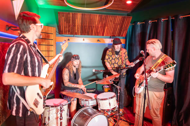 istock Middle Aged Men Playing in a Rock Music Band 2199021718
