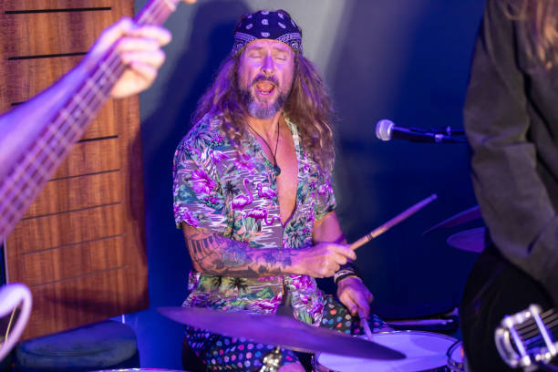 istock Energetic Middle Aged Drummer Playing Music 2199021720