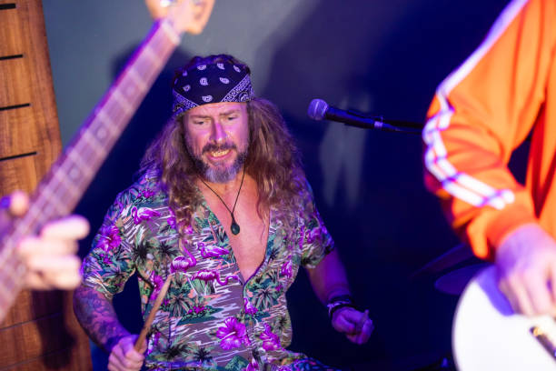 istock Energetic Middle Aged Drummer Playing Music 2199021727