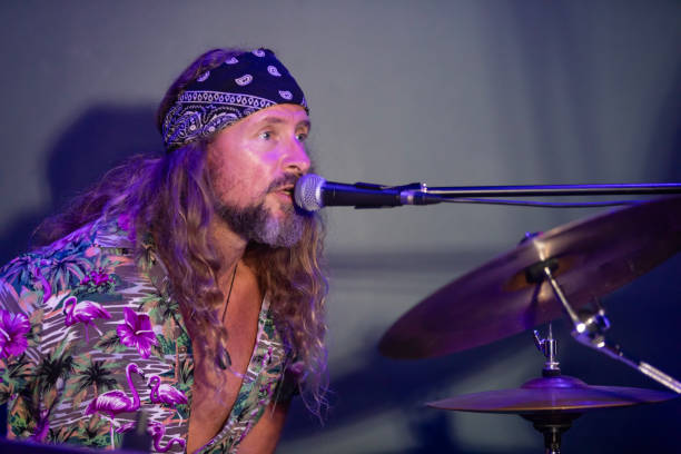 Energetic Middle Aged Drummer Playing Music