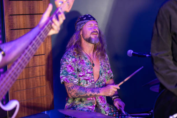 istock Energetic Middle Aged Drummer Playing Music 2199021737