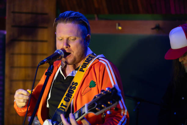 Middle aged rock musician having fun playing