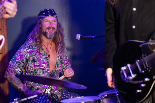 istock Energetic Middle Aged Drummer Playing Music 2199021766