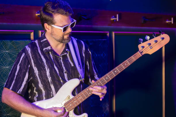istock Middle aged rock musician having fun playing 2199021779