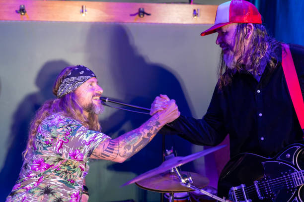 istock Happy Musicians Congratulating Each Other 2199021783