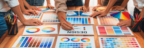 istock Graphic designer brainstorming logo and graphic arts at workshop. Scrutinize 2199022087