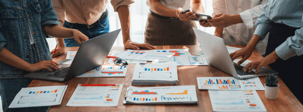 istock Analyst team utilizing BI Fintech to analyze financial dashboard. Scrutinize 2199022146