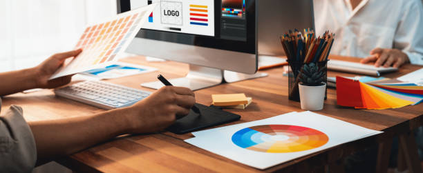istock Graphic designer works on computer laptop with digital pen. Scrutinize 2199022279
