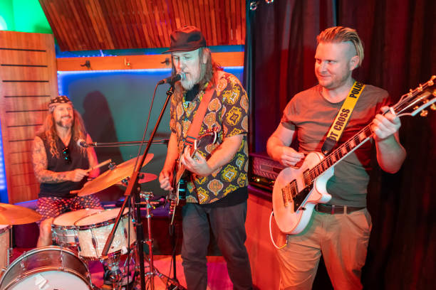istock Middle Aged Men Playing in a Rock Music Band 2199023135