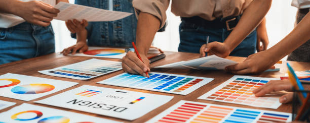 istock Graphic designer brainstorming logo and graphic arts at workshop. Scrutinize 2199023150