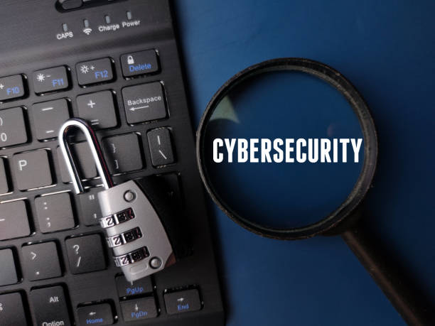istock Keyboard and padlock with the word CYBERSECURITY on a blue background 2199023530