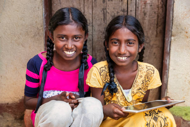 istock Sri Lankan young girls using a digital tablet 2199025858