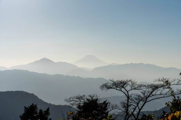 istock Fuji in fog between mountains 2199028420