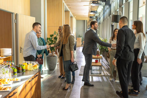 istock Diverse businesspeople greeting each other before seminar 2199034938