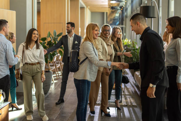 istock Businesspeople handshaking before conference 2199035063