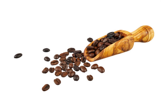 istock coffee beans on wooden spoon isolated on white 2199036175