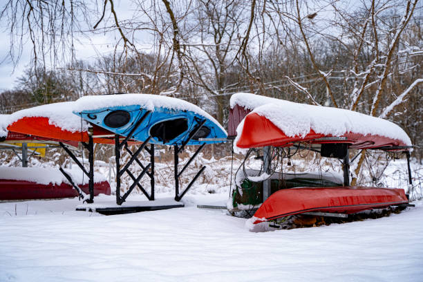 istock Snow-covered canoes in winter. 2199036208