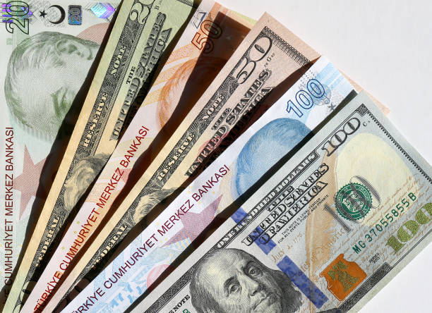 istock Turkish lira and US Dollar banknotes with White Background 2199038298