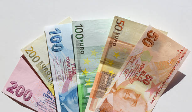 istock Turkish lira and Euro banknotes with White Background 2199038922