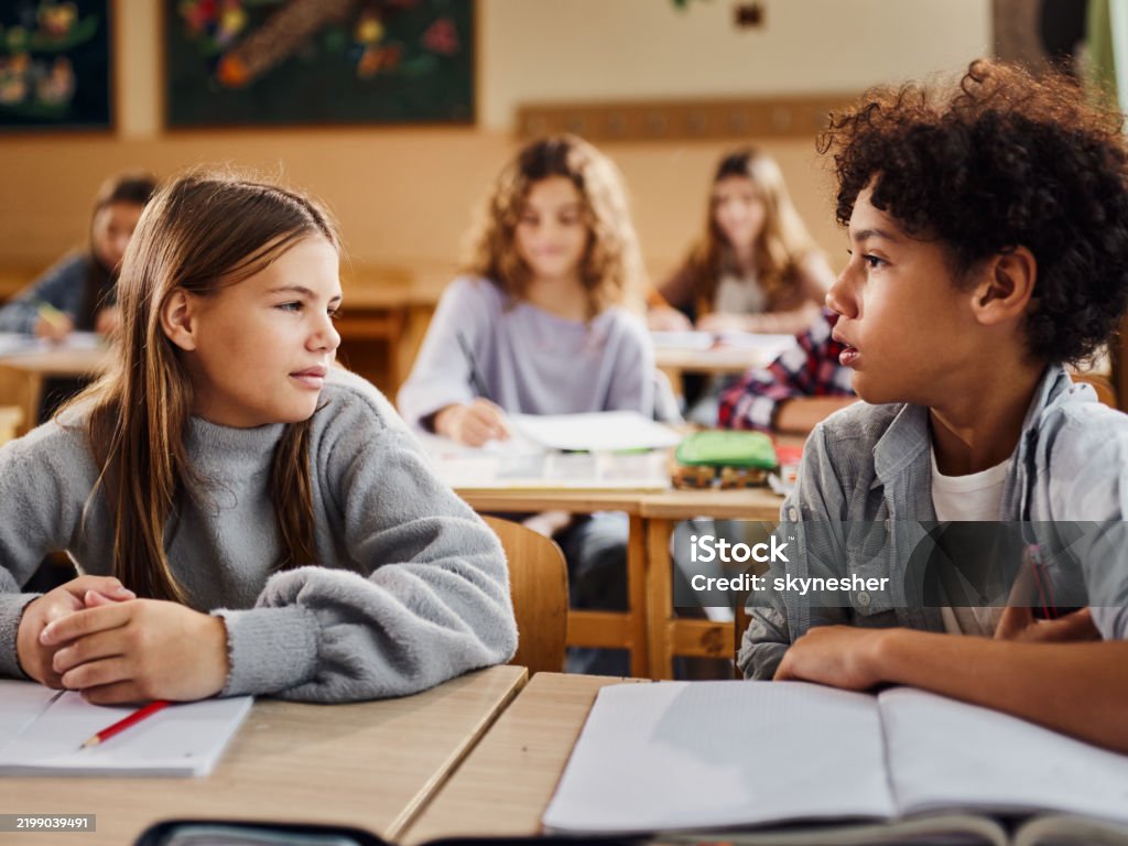 Chatting In Class Elementary School Kids Talking While Having A Class In The Classroom ...