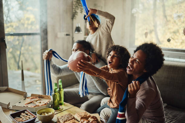 istock Cheering for favorite rugby team at home! 2199040278