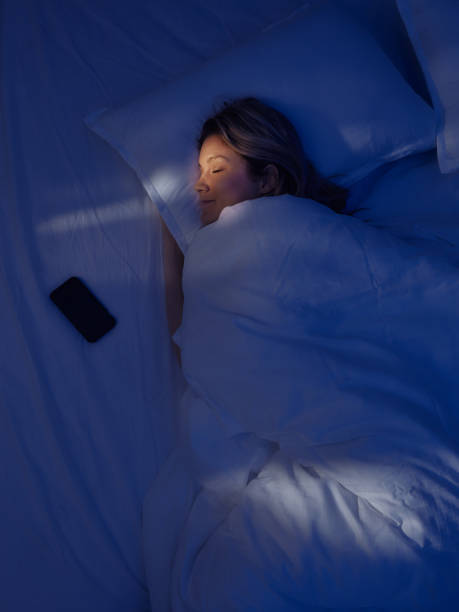 istock Above view of tired woman sleeping in bed. 2199042000