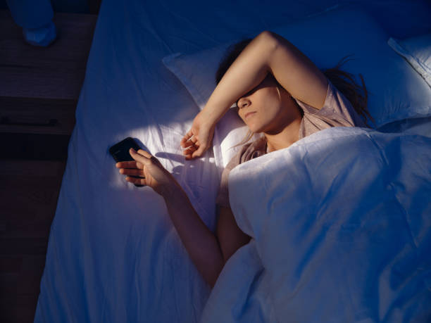 istock Snoozing my morning alarm on cell phone! 2199042226